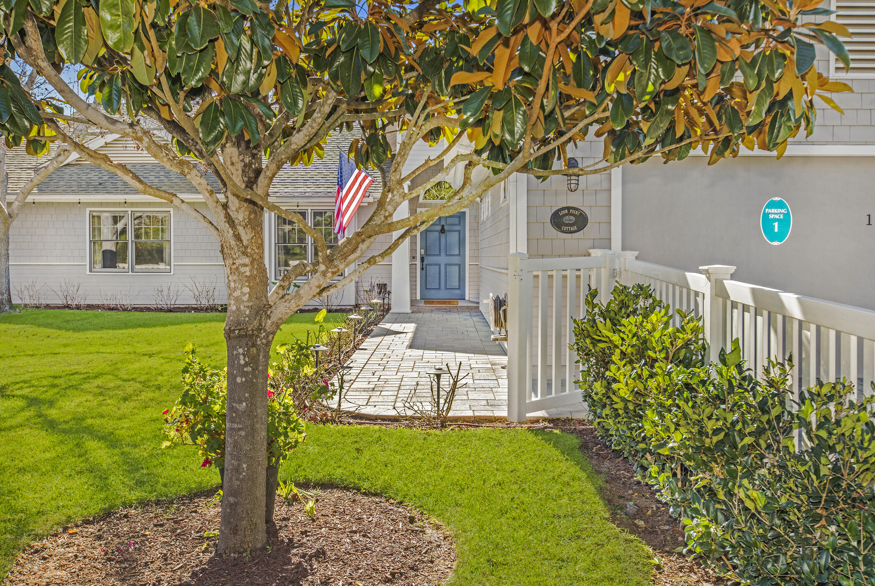 a front view of a house with garden