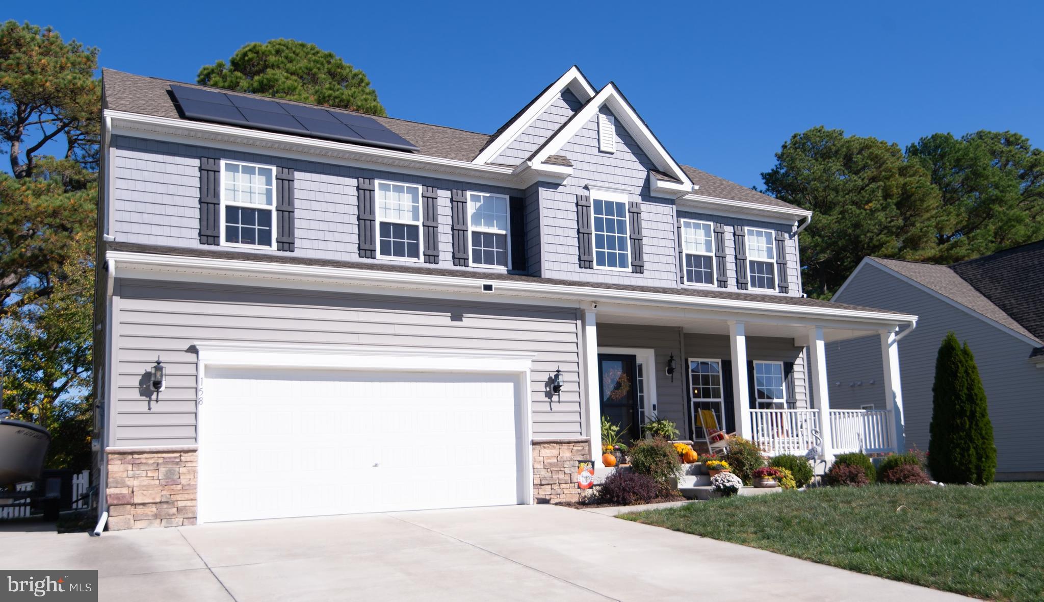 front view of a house with a garden