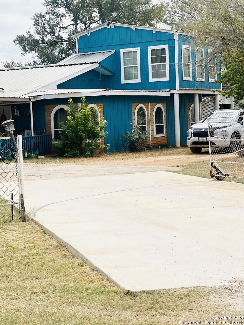 a front view of a house with parking space