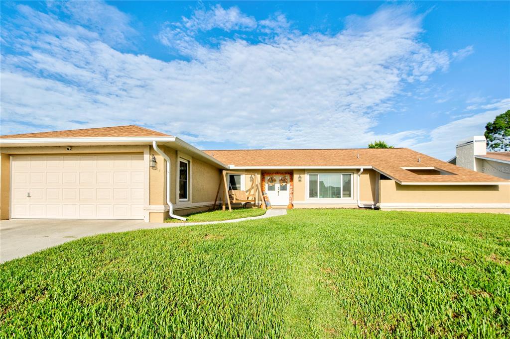 a house view with a garden space