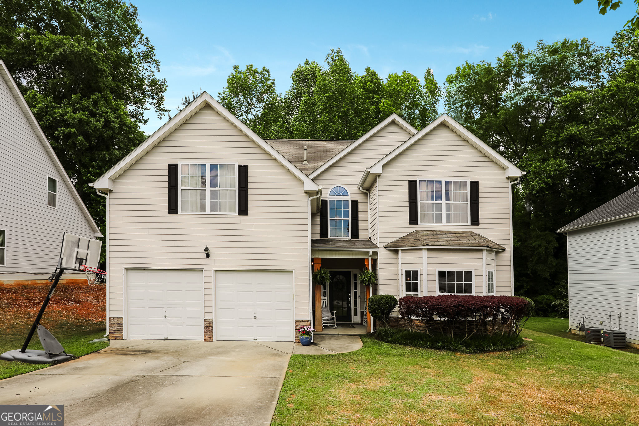 a front view of a house with a yard