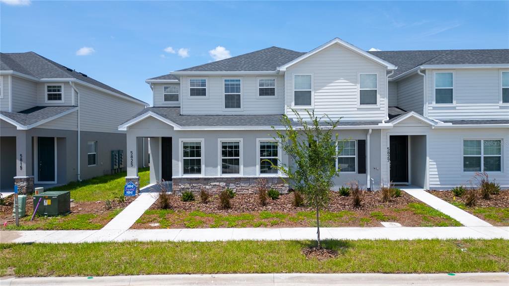 front view of a house with a yard