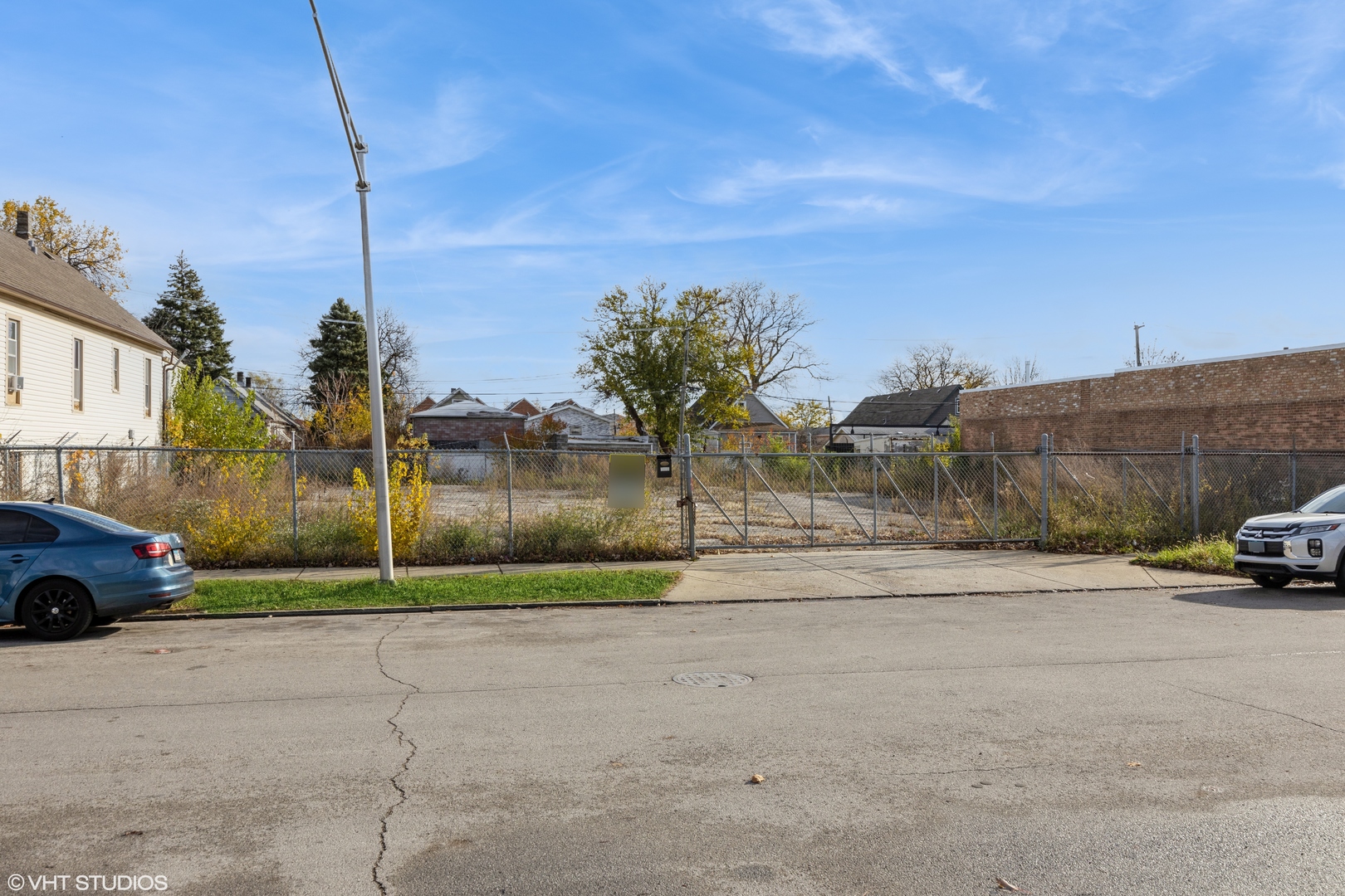 a view of street and parked cars