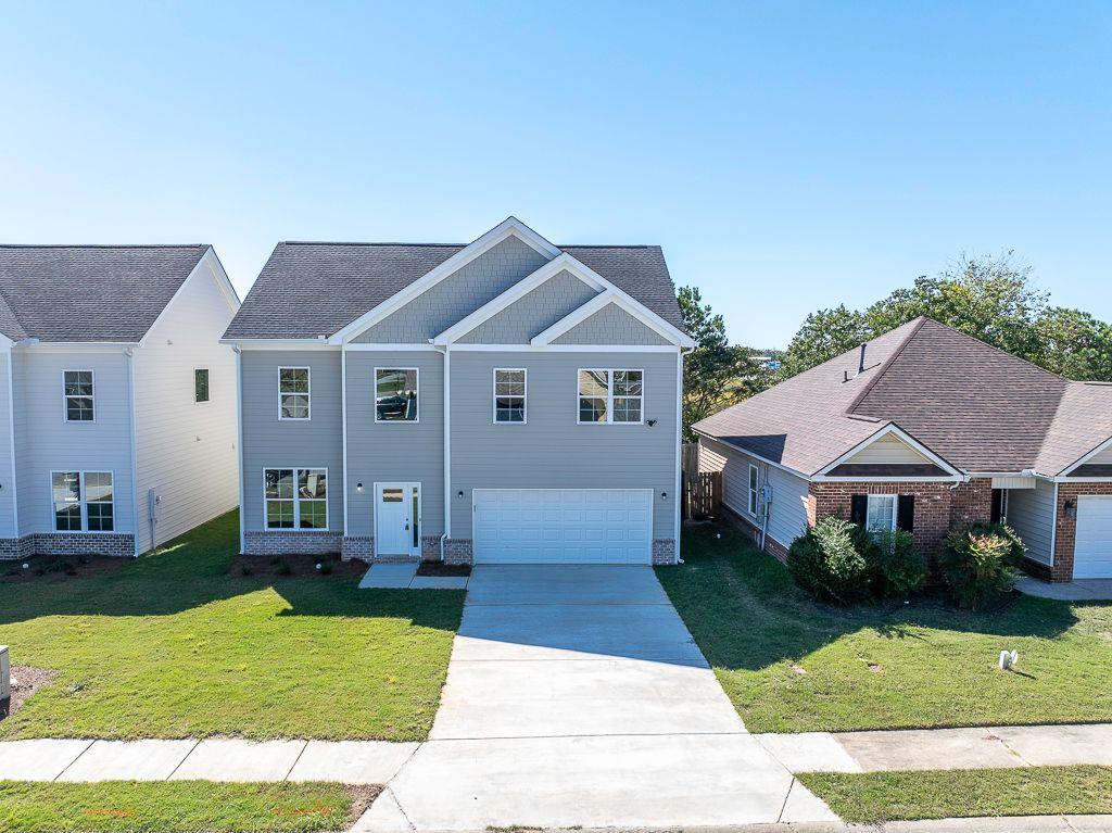 a front view of a house with a yard