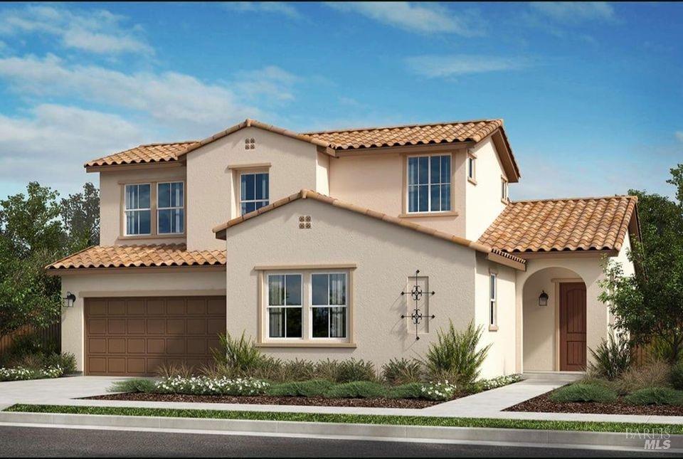 a front view of a house with a yard garage and garage