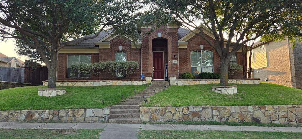 front view of a house with a yard