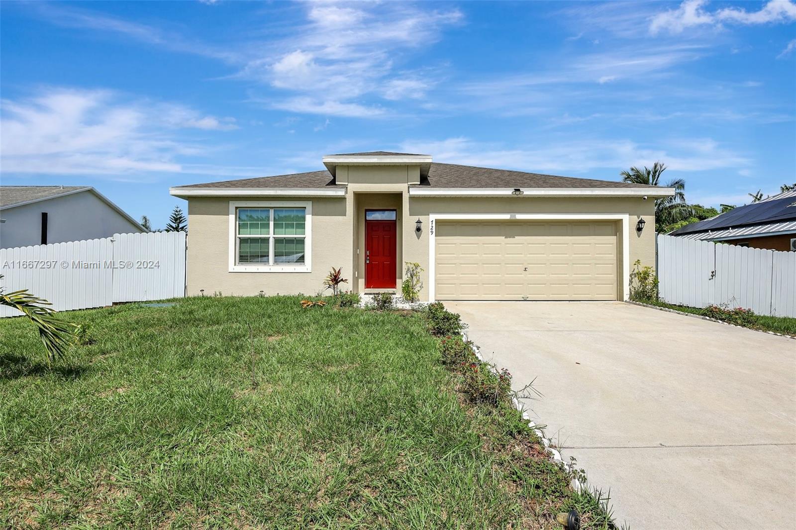 front view of a house with a yard