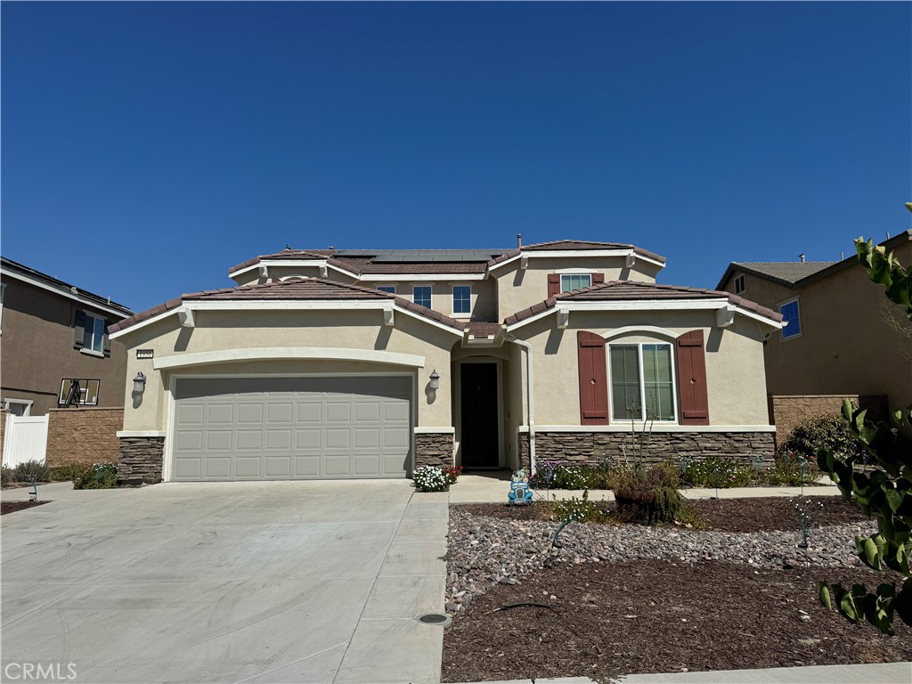 a front view of a house with a garage