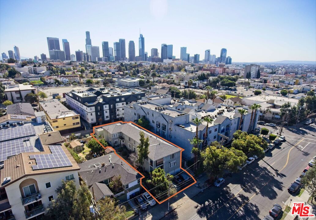 an aerial view of a city with lots of residential buildings