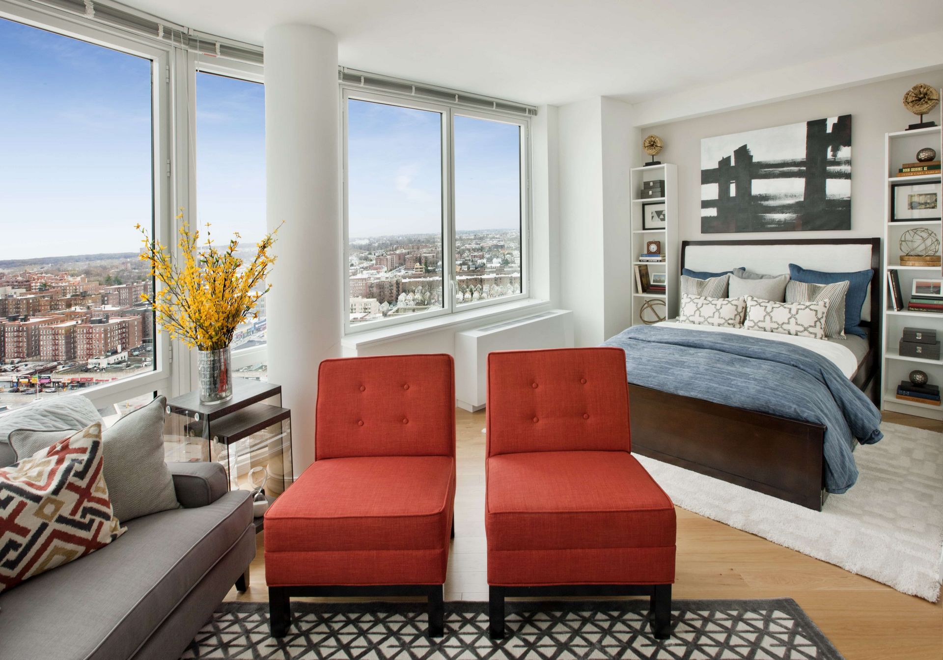 a bedroom with a bed couch and window