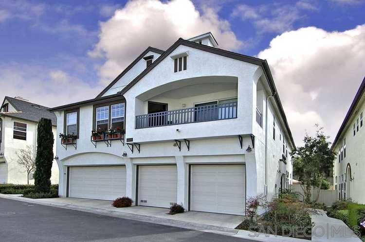 a front view of a house with garage