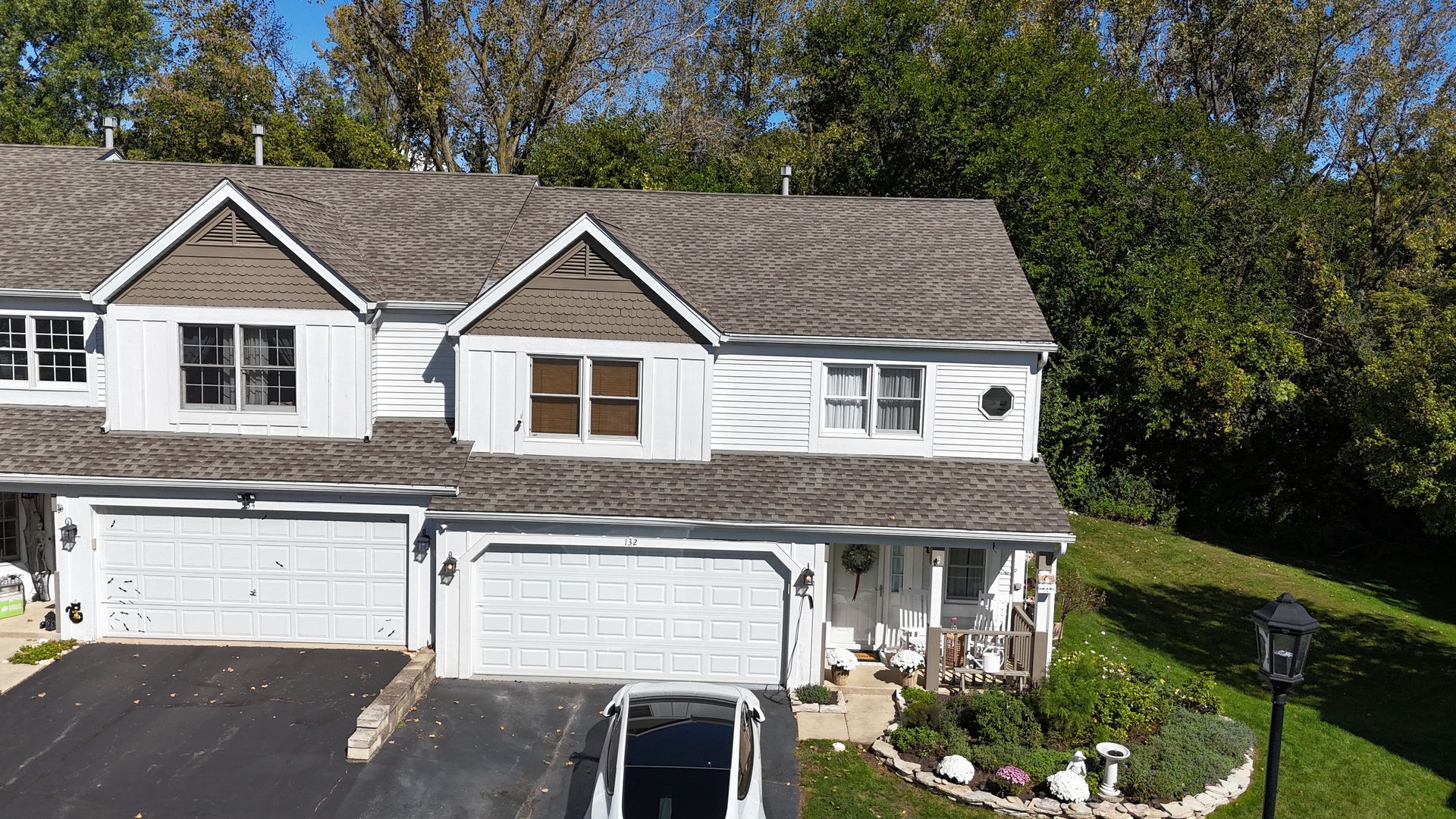 a aerial view of a house yard and mountain view