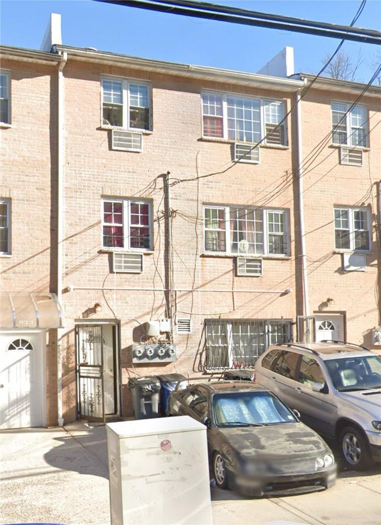 a view of a brick building with many windows