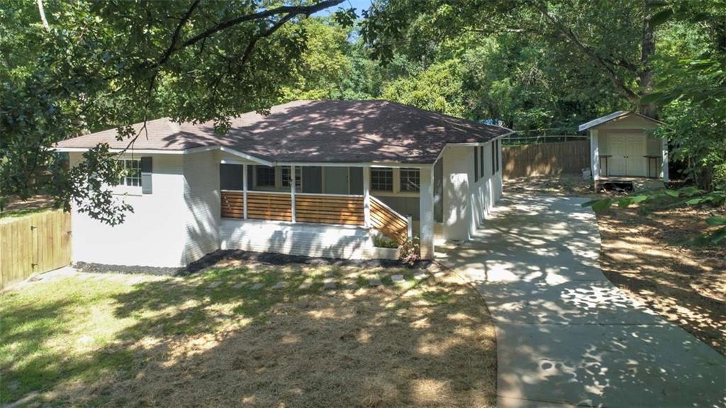 a view of a house with a yard