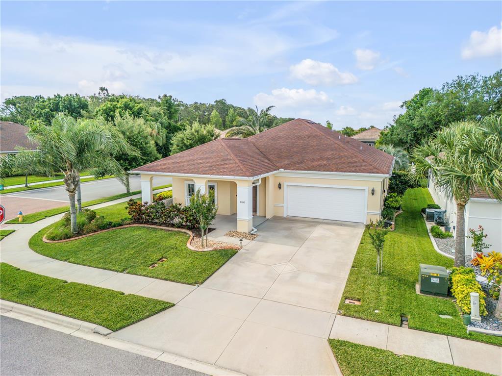 a aerial view of house with yard