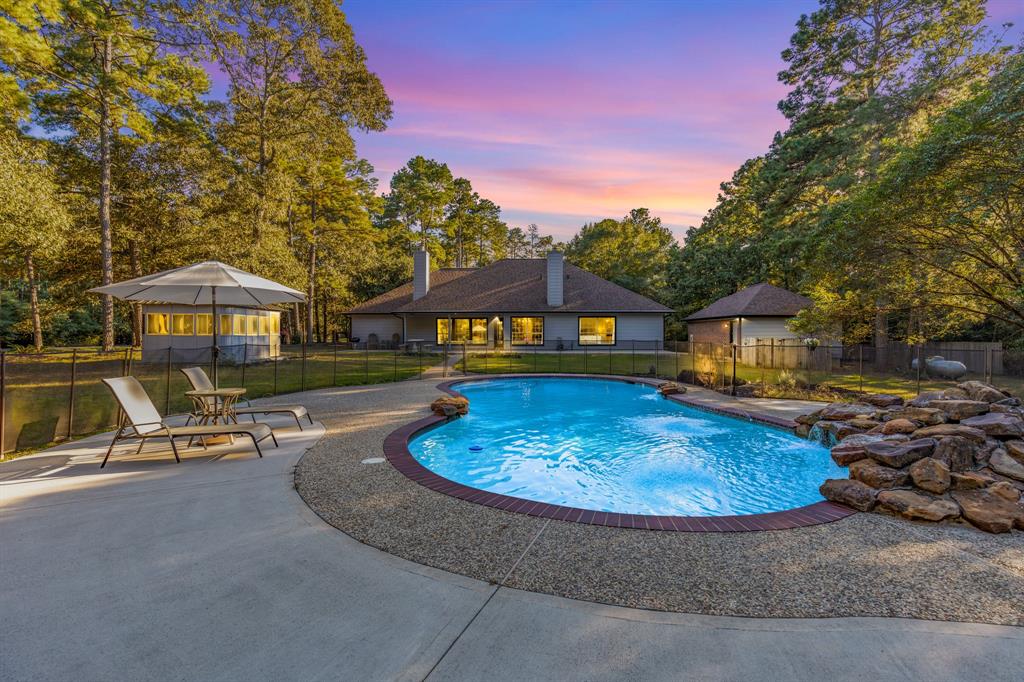 a swimming pool with outdoor seating