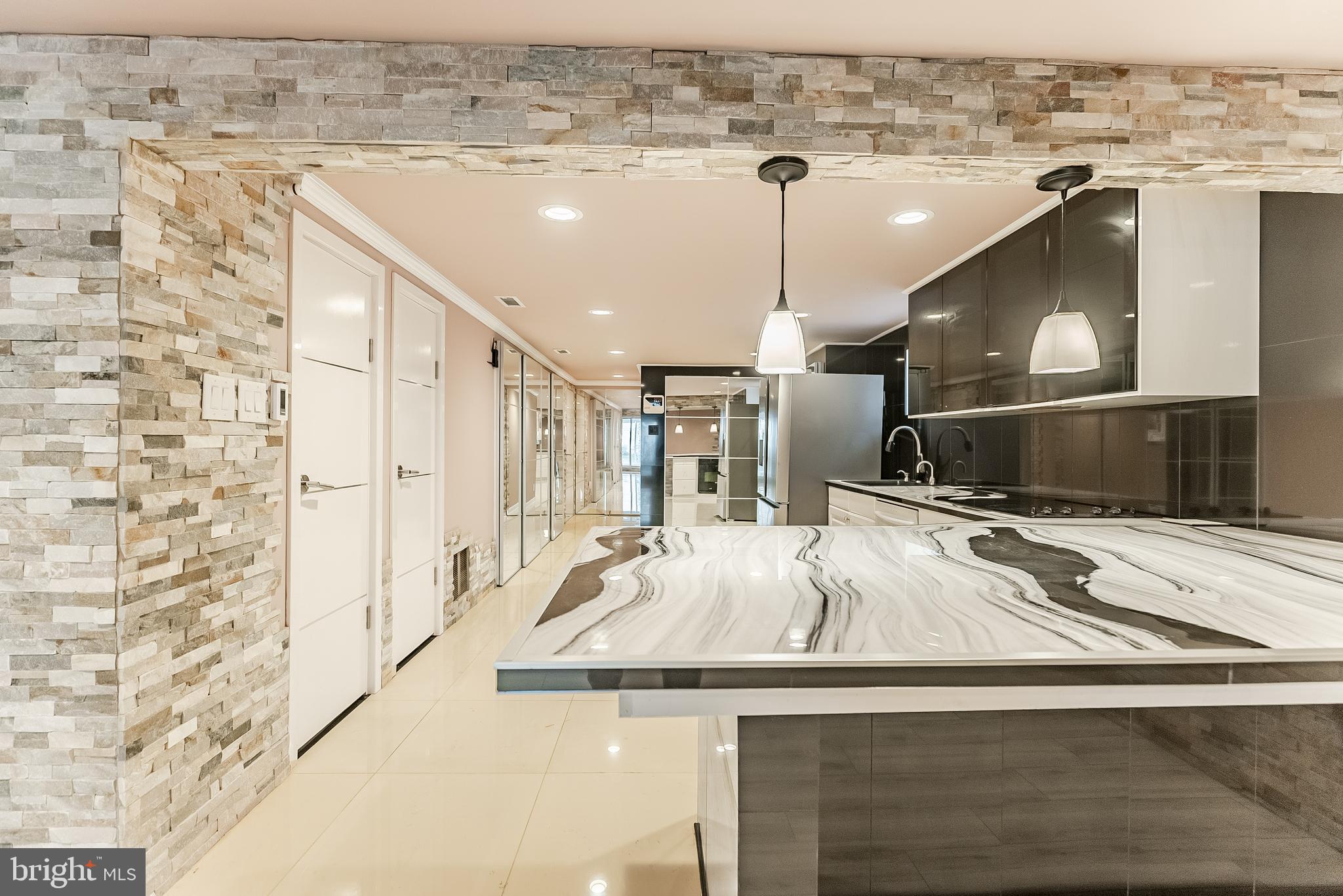 a kitchen with a sink appliances and a counter top space