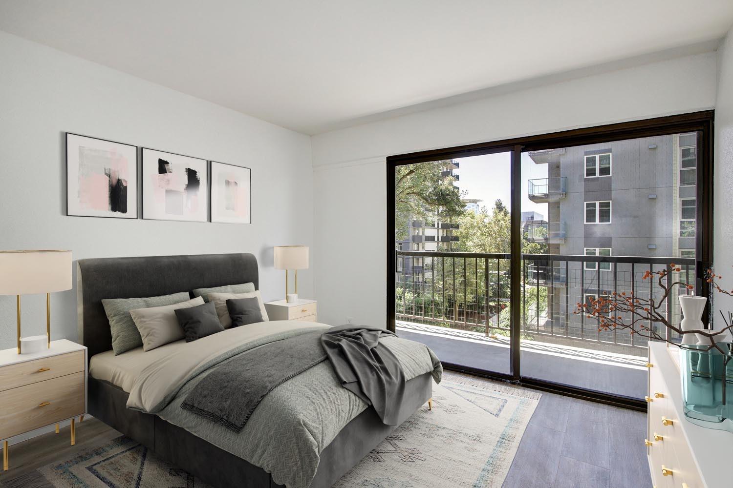 a bedroom with a bed and a large window