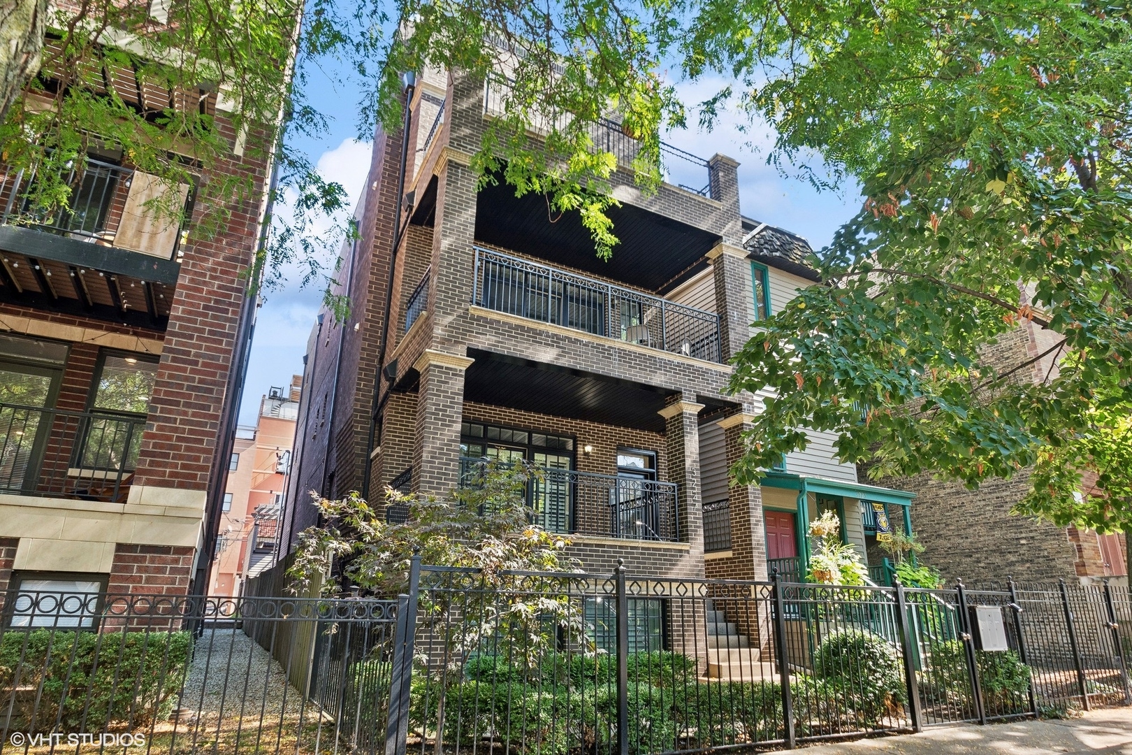 a view of a house with a tree front of house