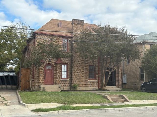 a view of a building with a yard