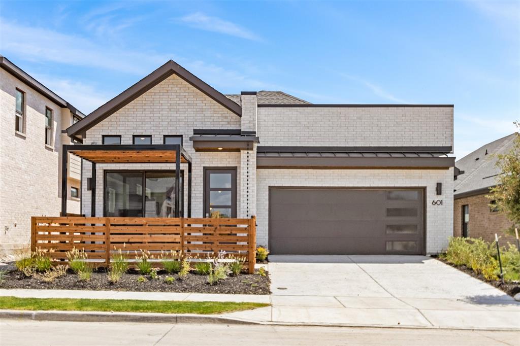 a view of a house with a yard and garage