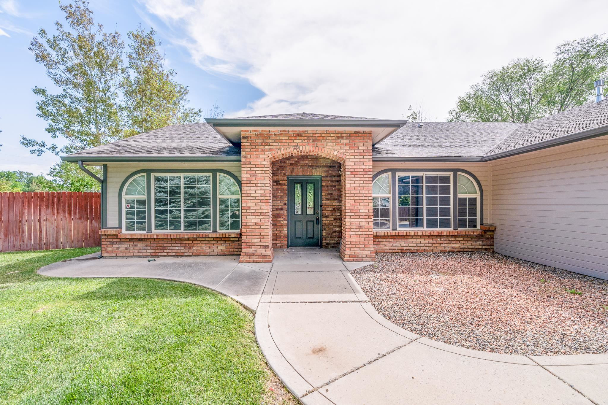 front view of a house with a yard