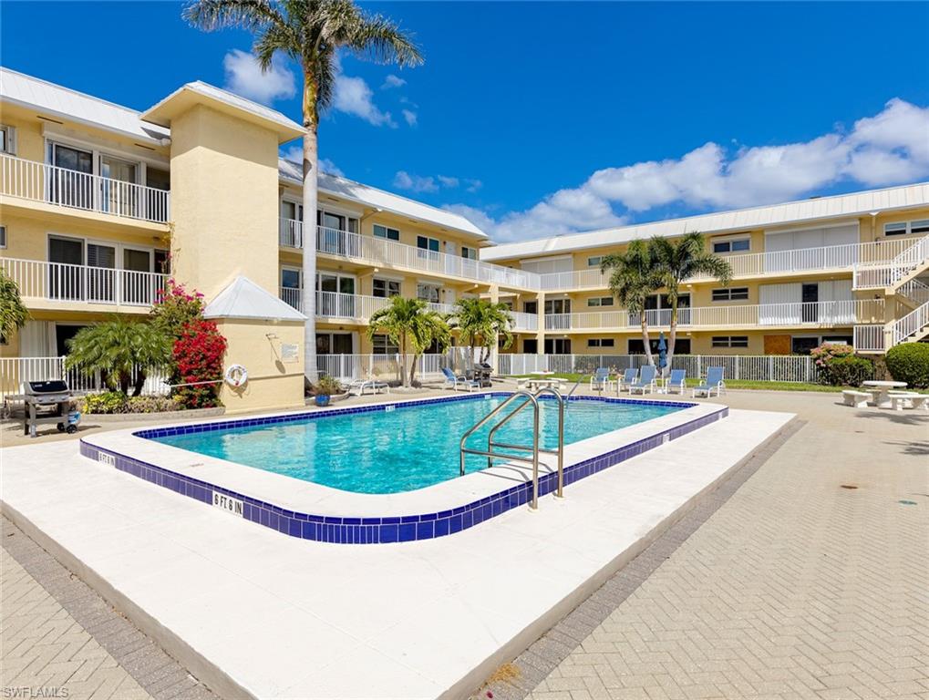 a view of a swimming pool with a patio