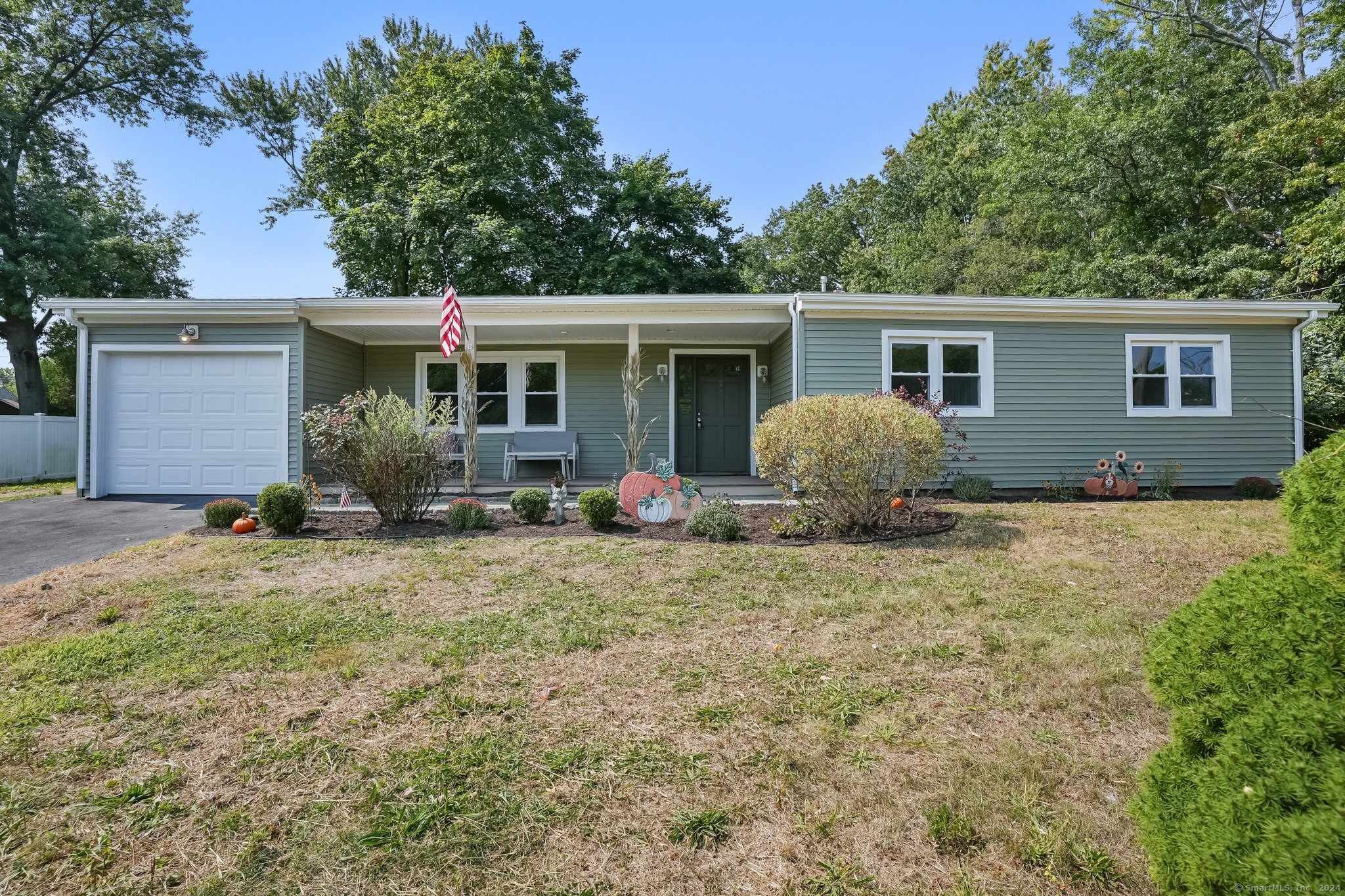 front view of a house with a yard