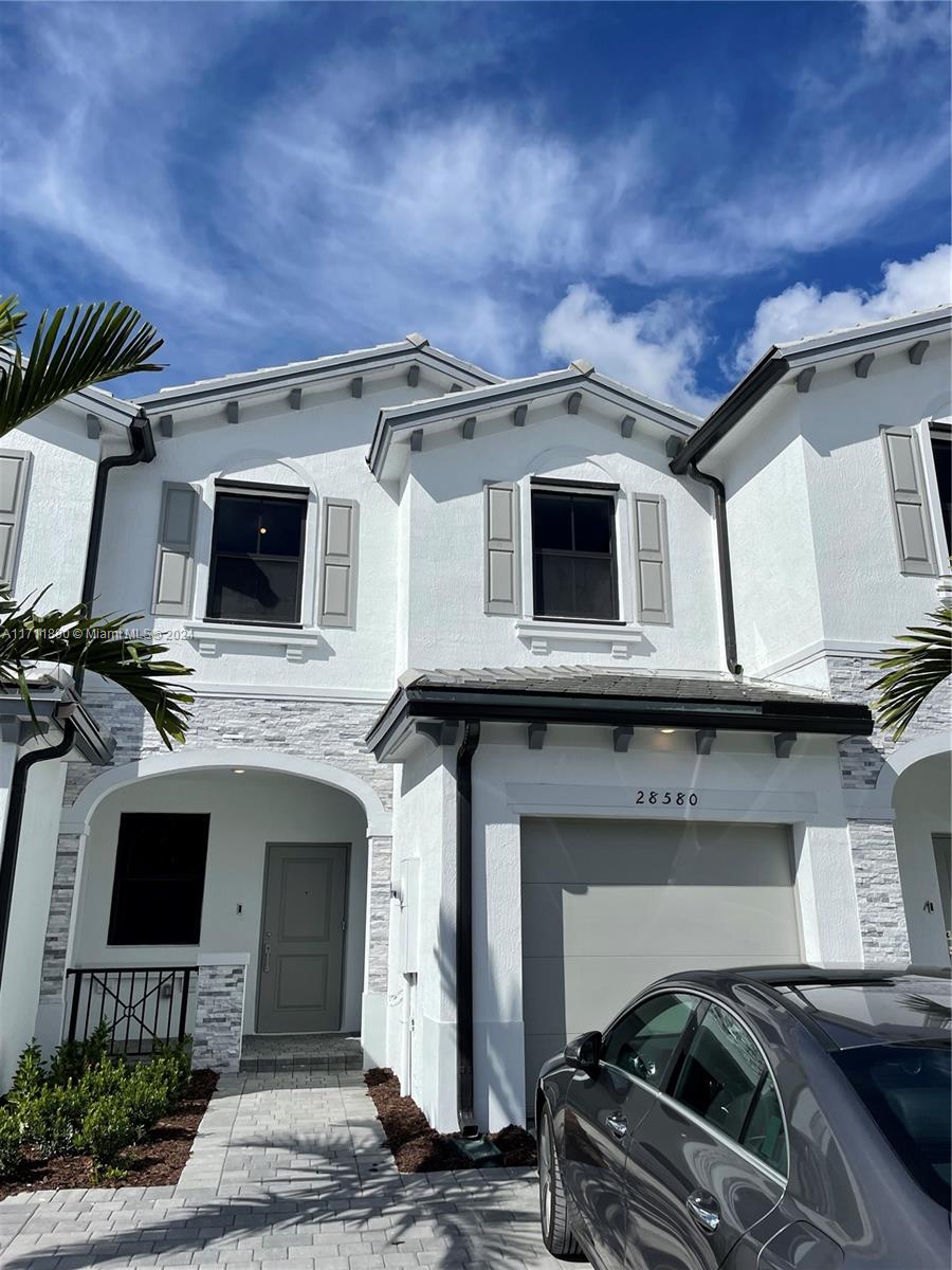 a view of a car park in front of house