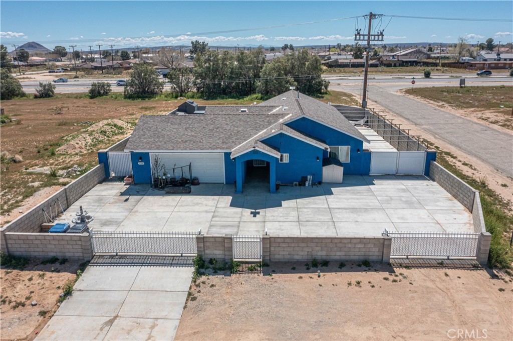 a aerial view of a house with a yard