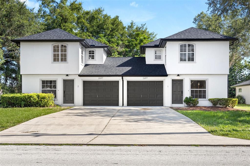 a front view of a house with yard