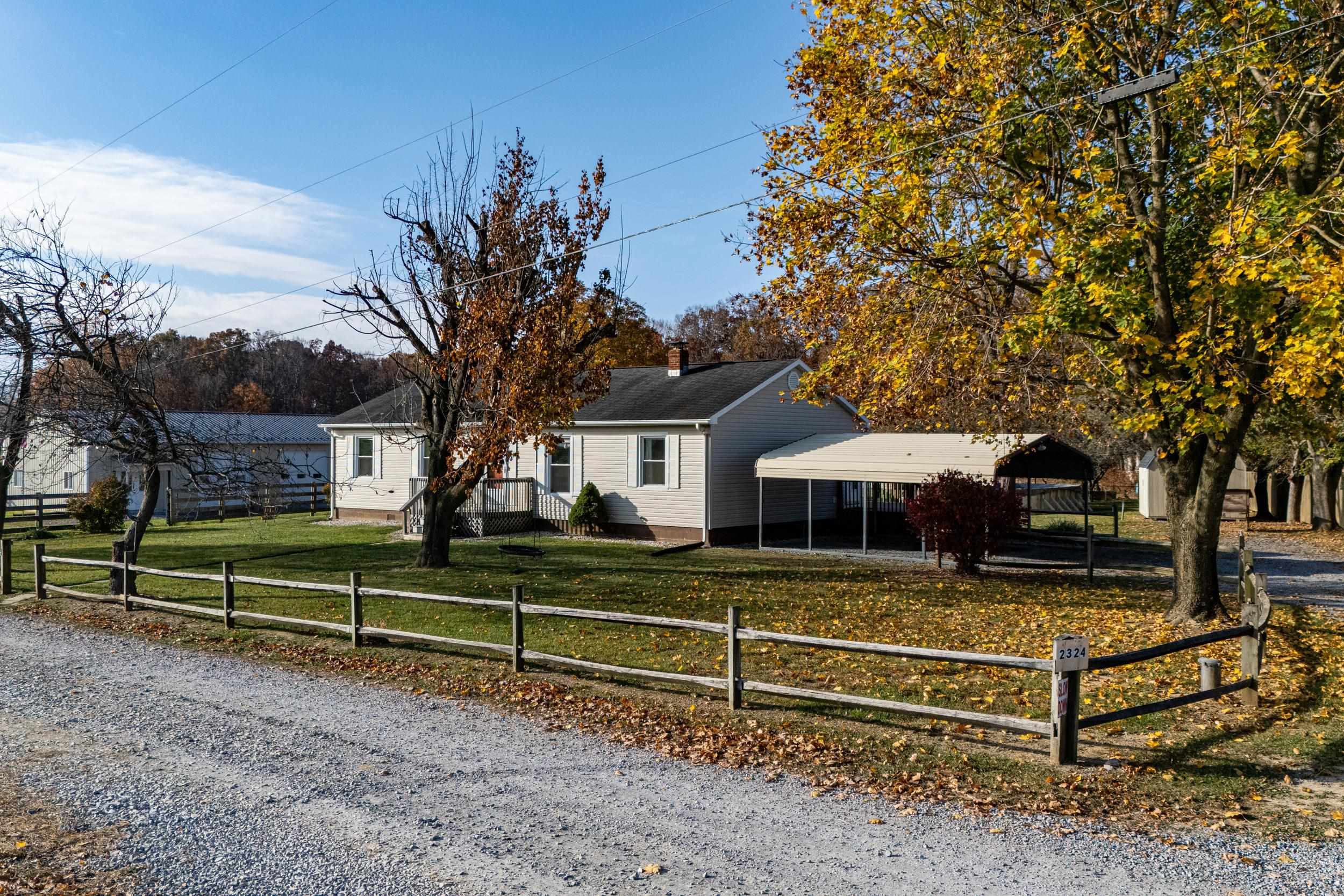 a view of a house with a yard