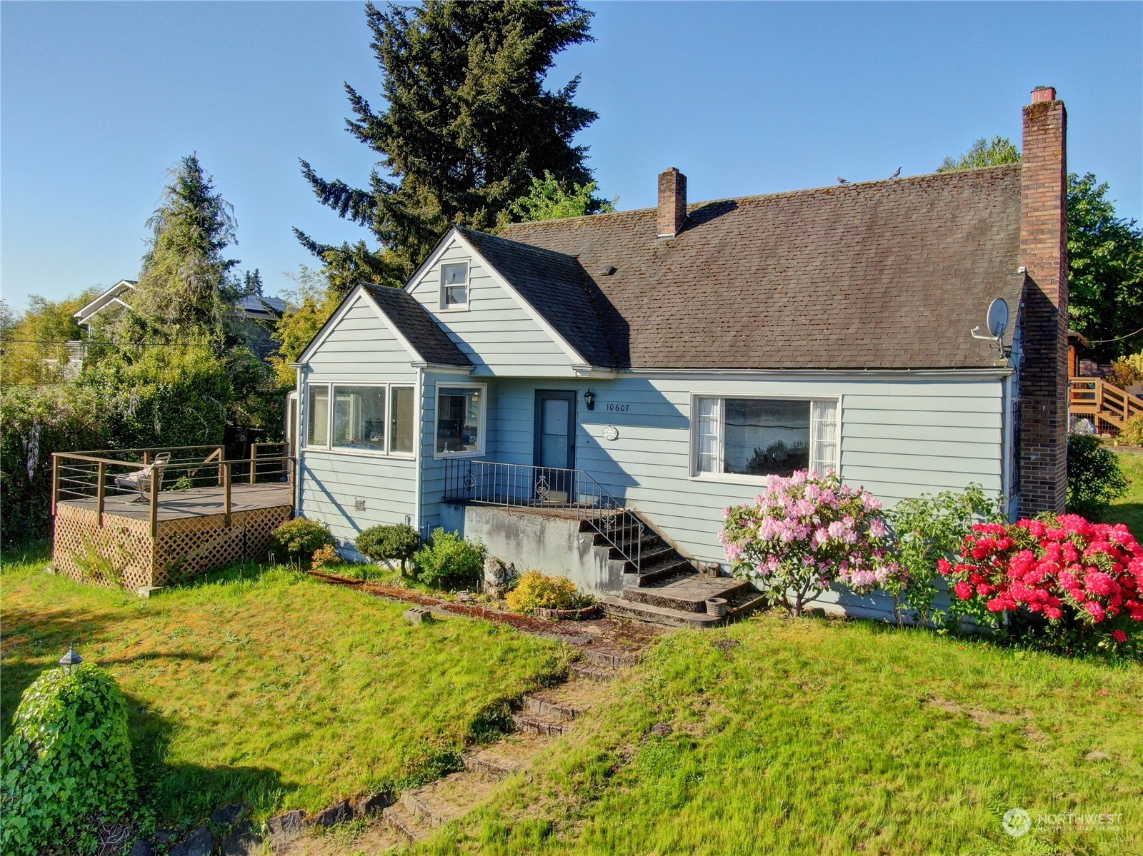 a front view of a house with garden