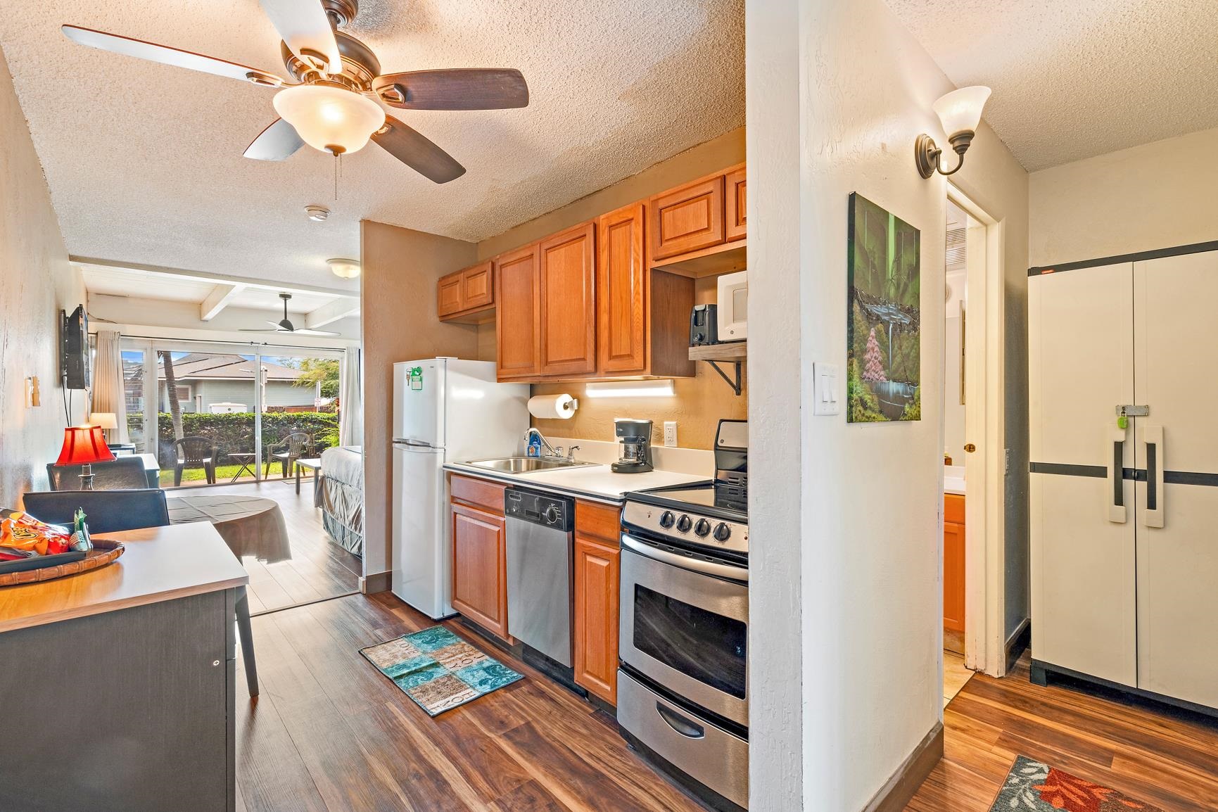 a kitchen with stainless steel appliances a stove a refrigerator and cabinets