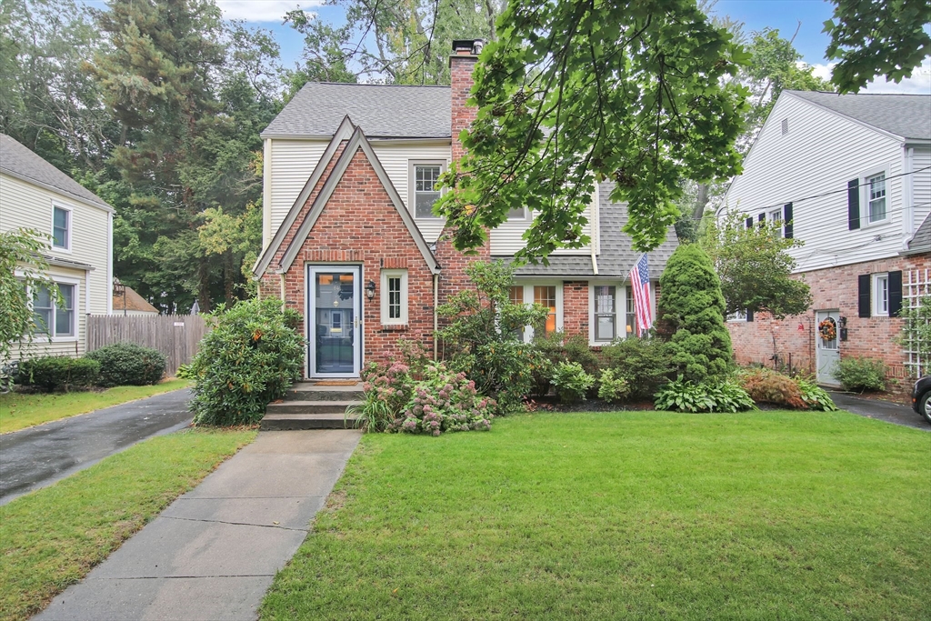 a front view of a house with garden