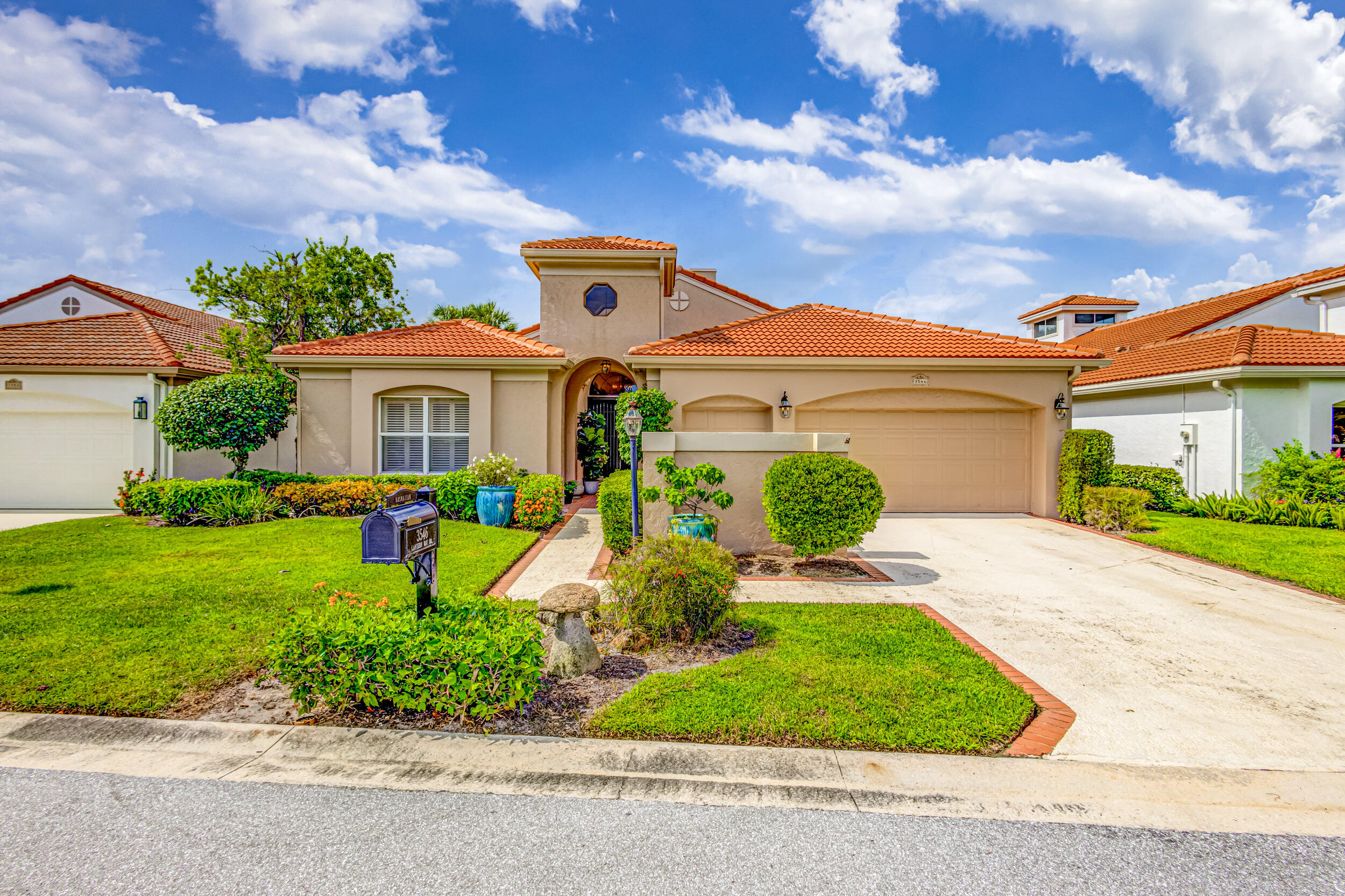 a front view of a house with garden