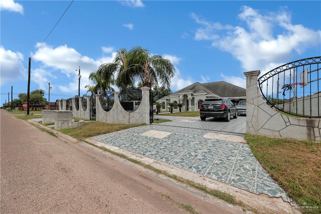 a view of a house with a yard