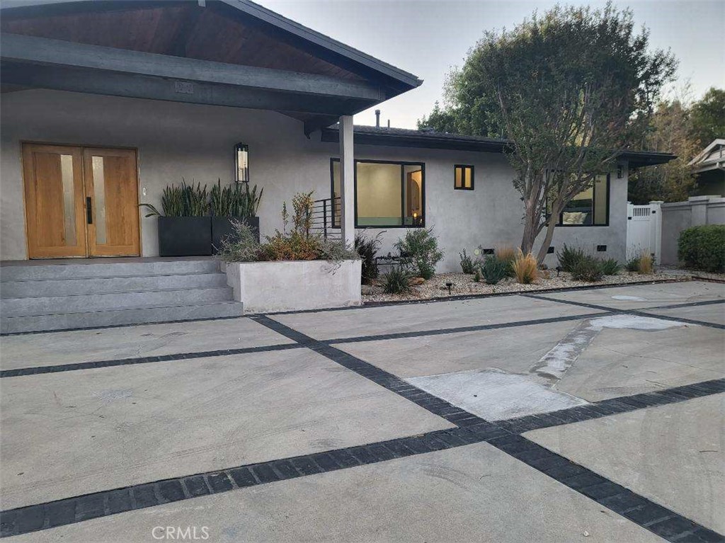 a front view of a house with garage