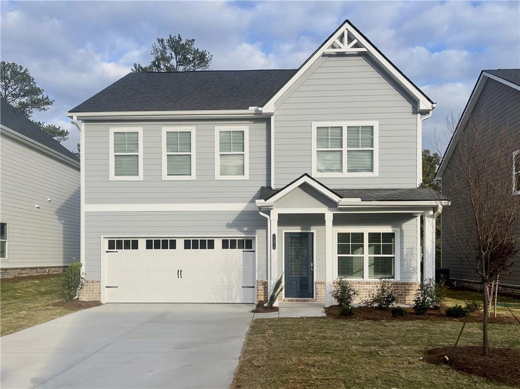 a front view of a house with a yard