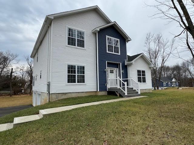 a view of house with backyard