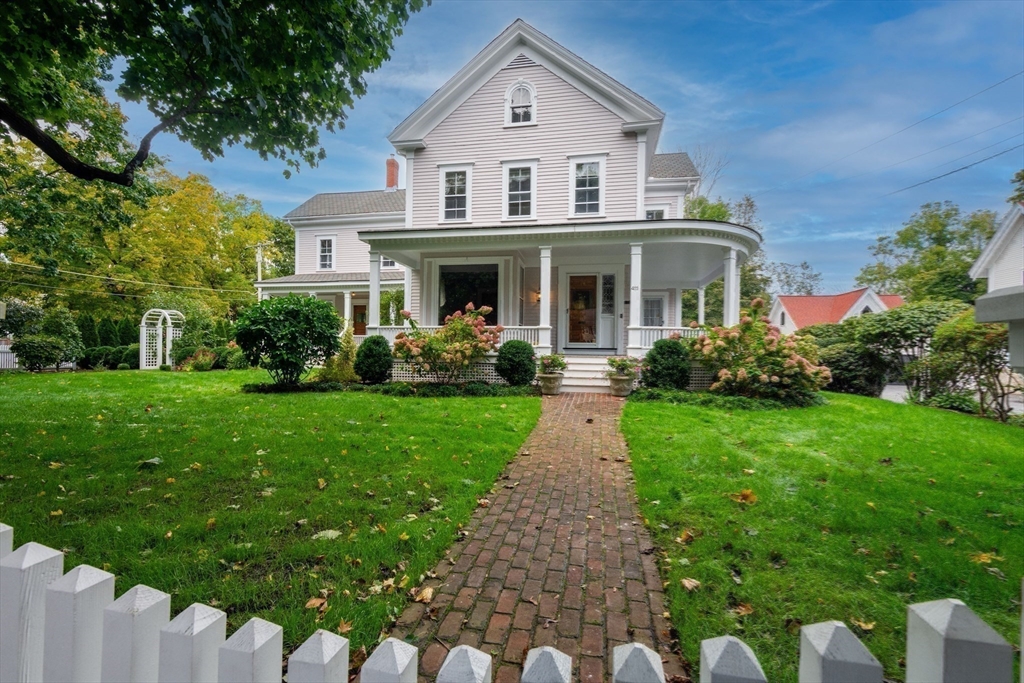 a front view of a house with garden