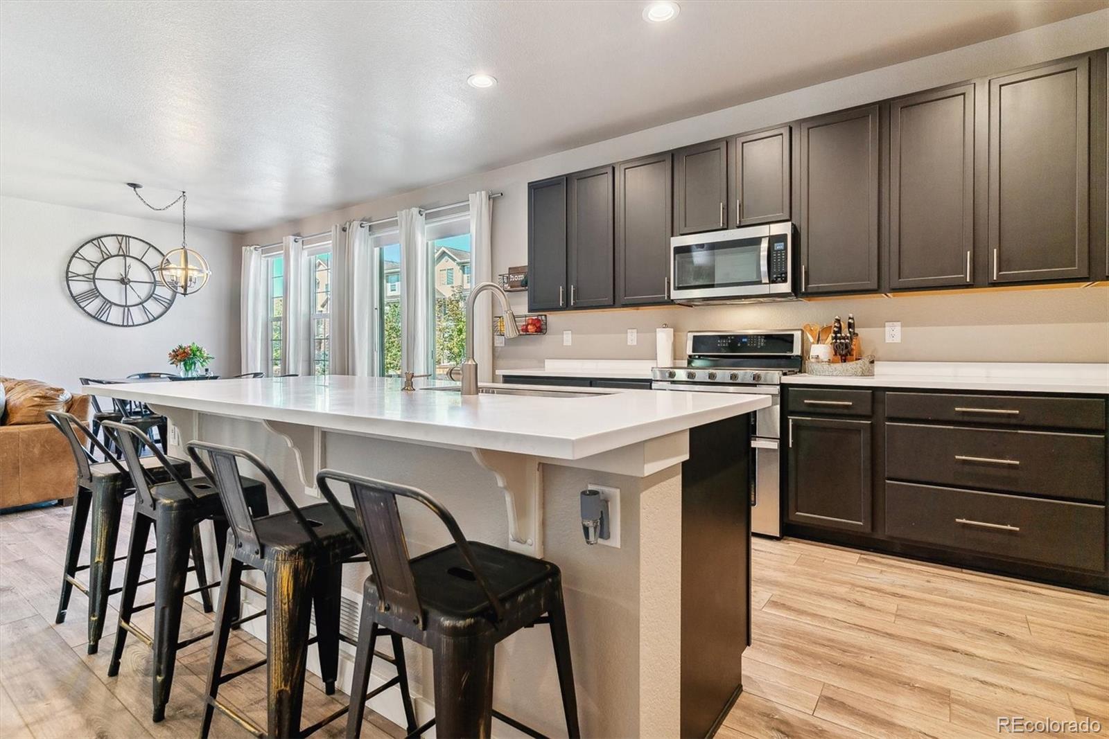 a kitchen with stainless steel appliances granite countertop a sink and cabinets