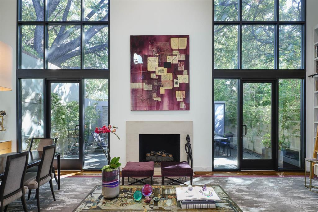 a living room with furniture a window and a fireplace