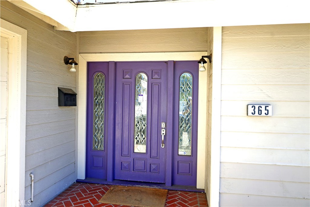 a view of front door with a mirror