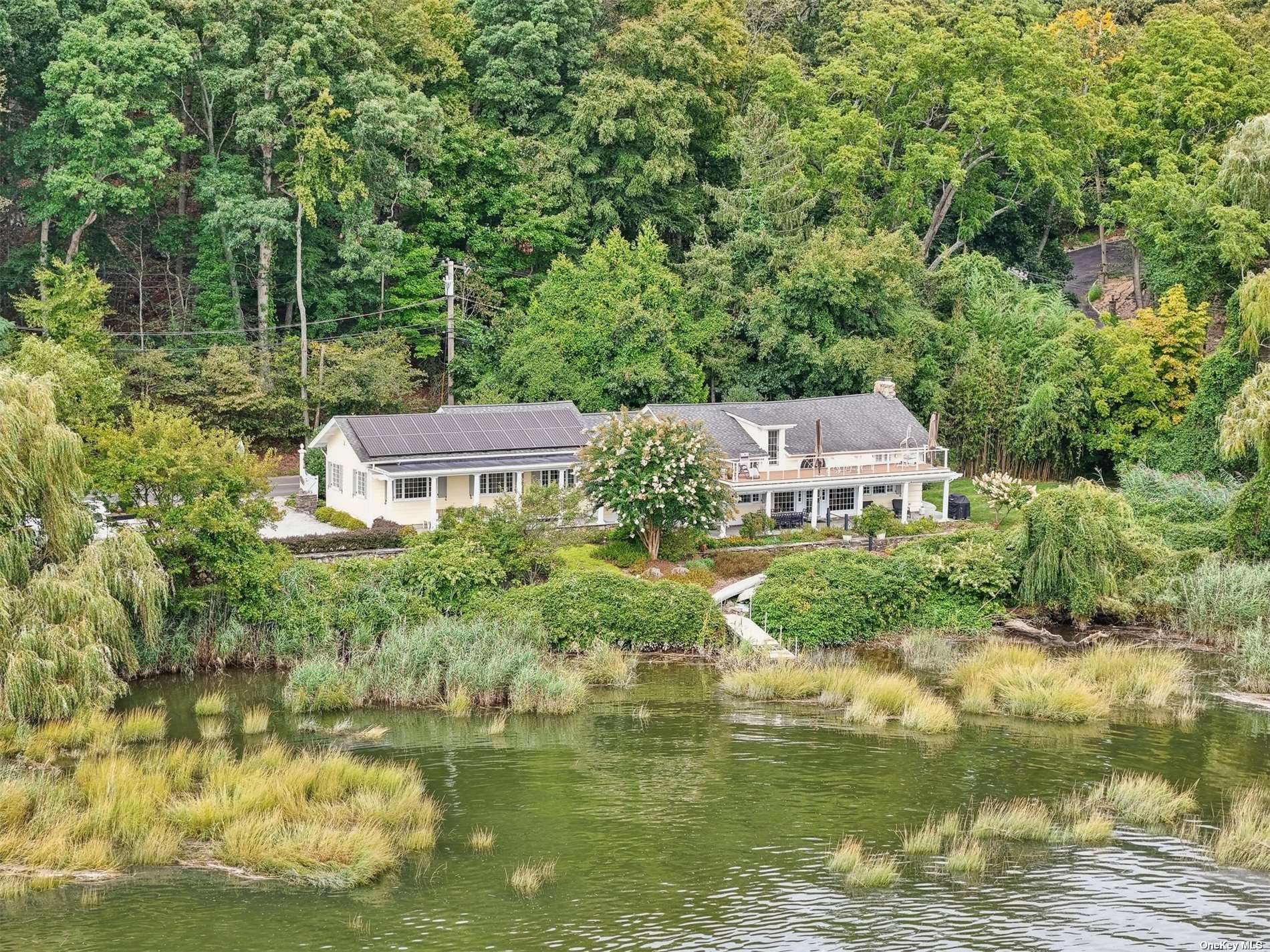 a aerial view of a house with a yard