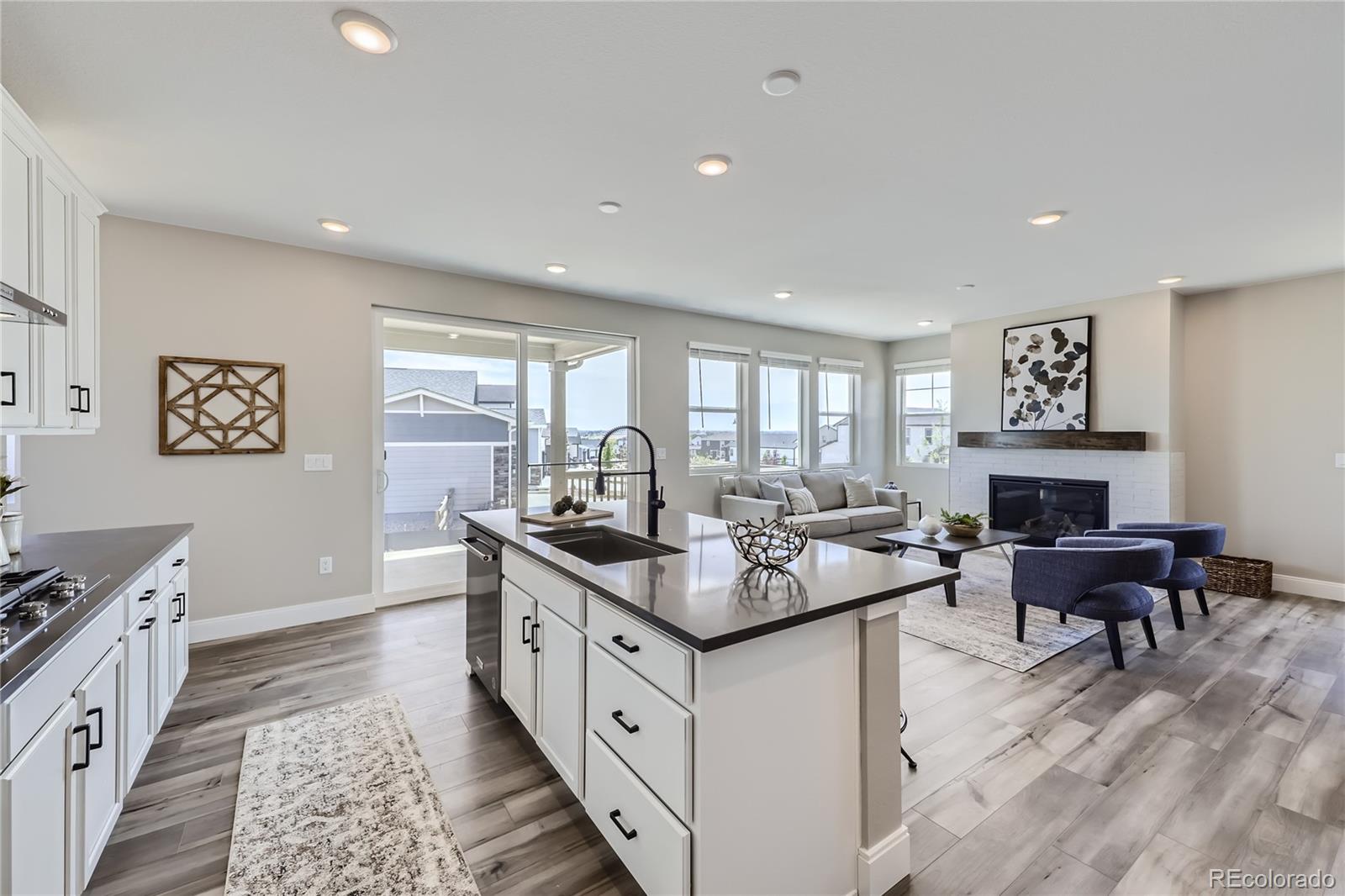 a kitchen with sink stove and cabinets