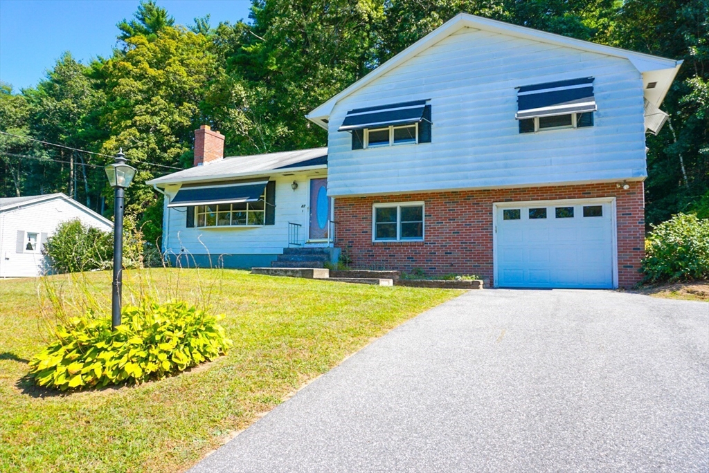 a front view of a house with a swimming pool