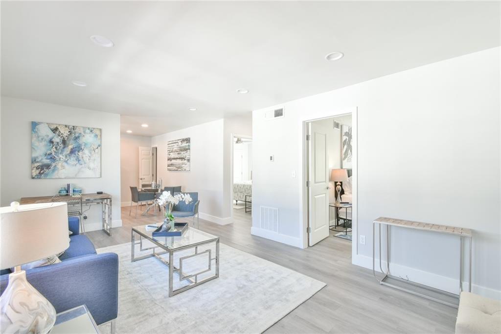 a living room with furniture and a table