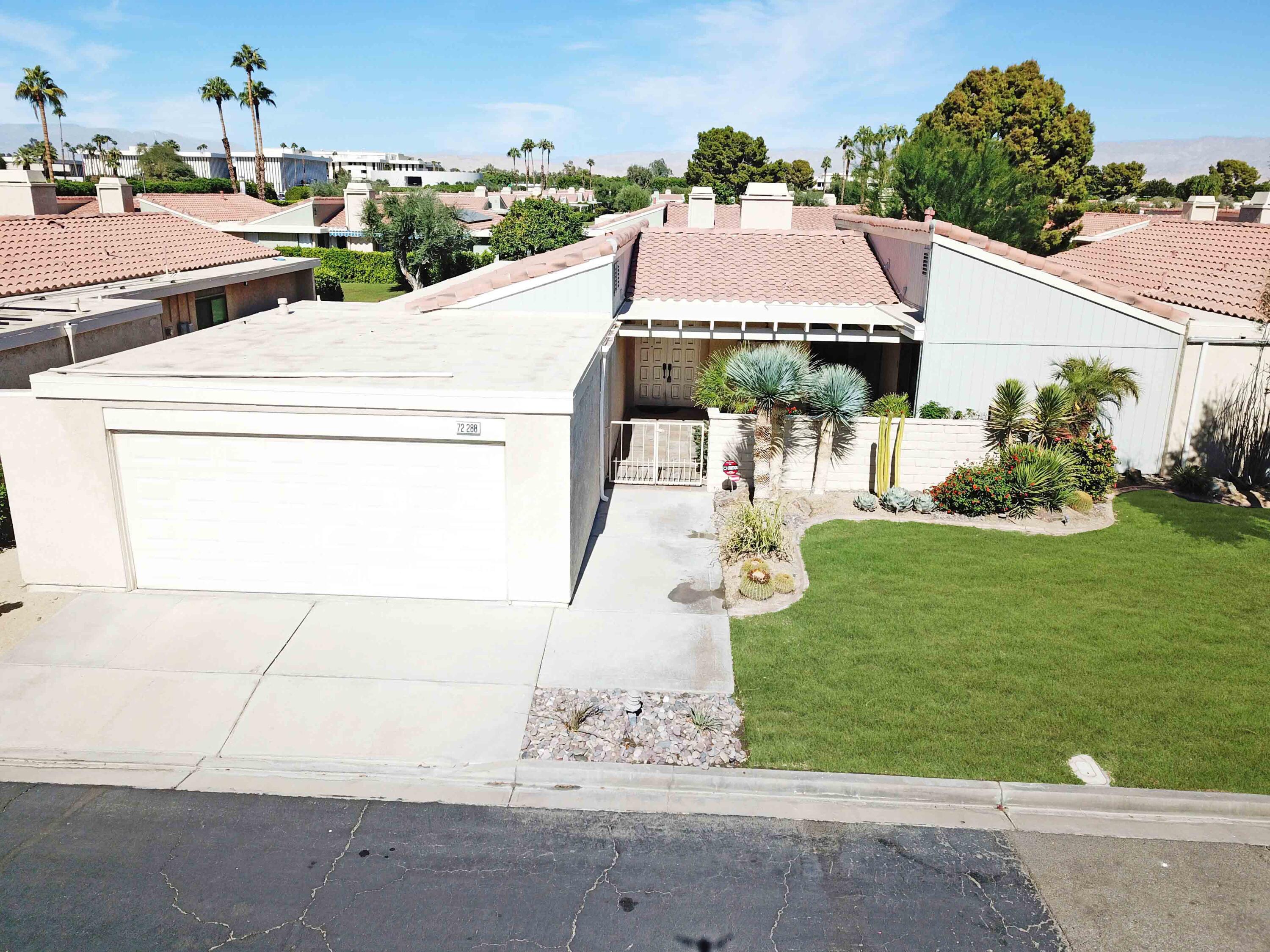 a aerial view of a house with garden