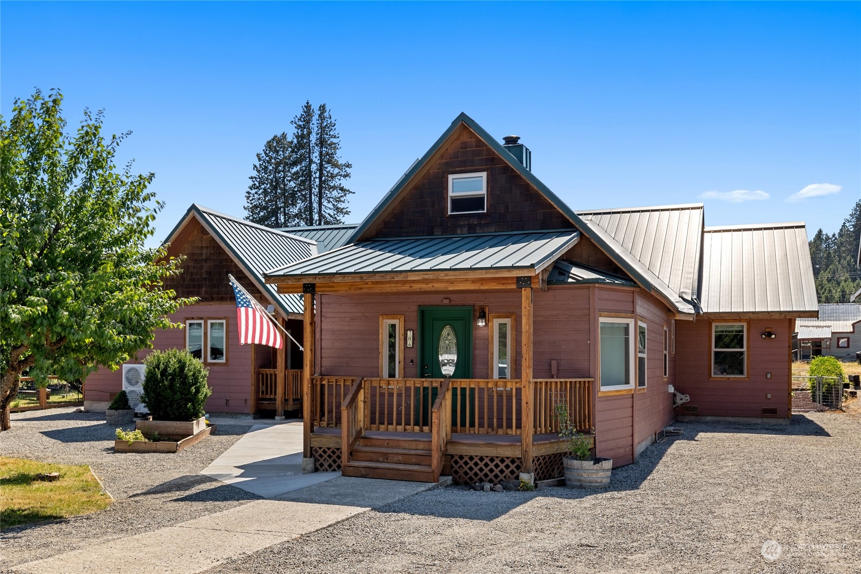 a front view of a house with a yard outdoor seating and barbeque oven